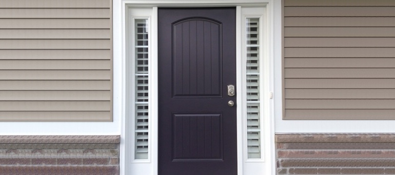 Sidelight Shutters On Black Door In New York City, NY